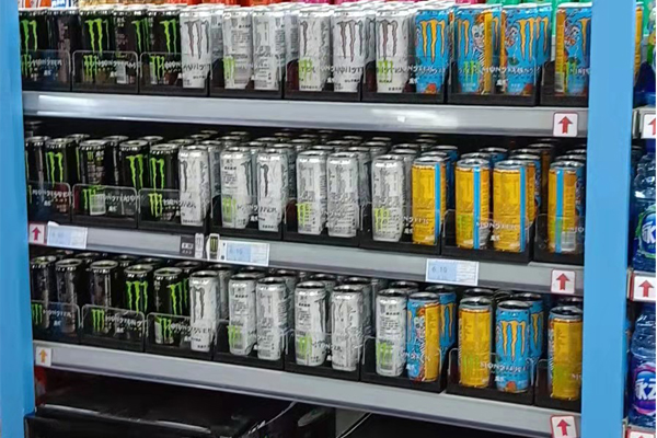 Gravity shelf pusher